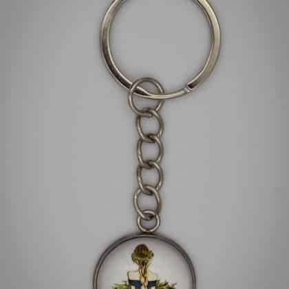 Sötétkék ruhás lány virággal kulcstartó