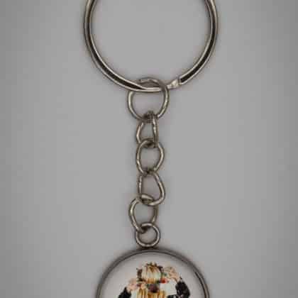 Sötétkék ruhás lány kulcstartó